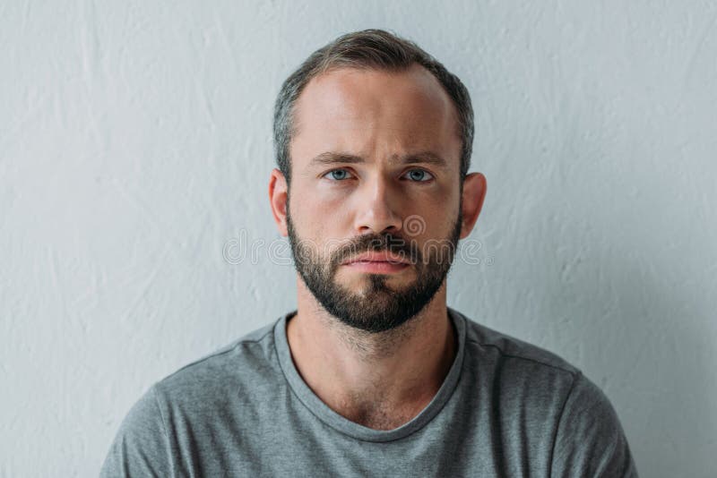 portrait of unhappy bearded man