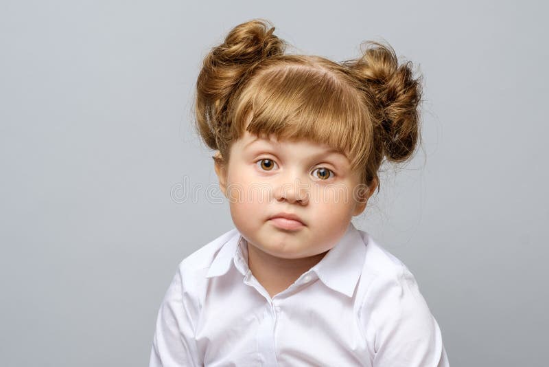 Portrait of unhappy little girl isolated. Negative moody stock images, royalty-free photos and pictures