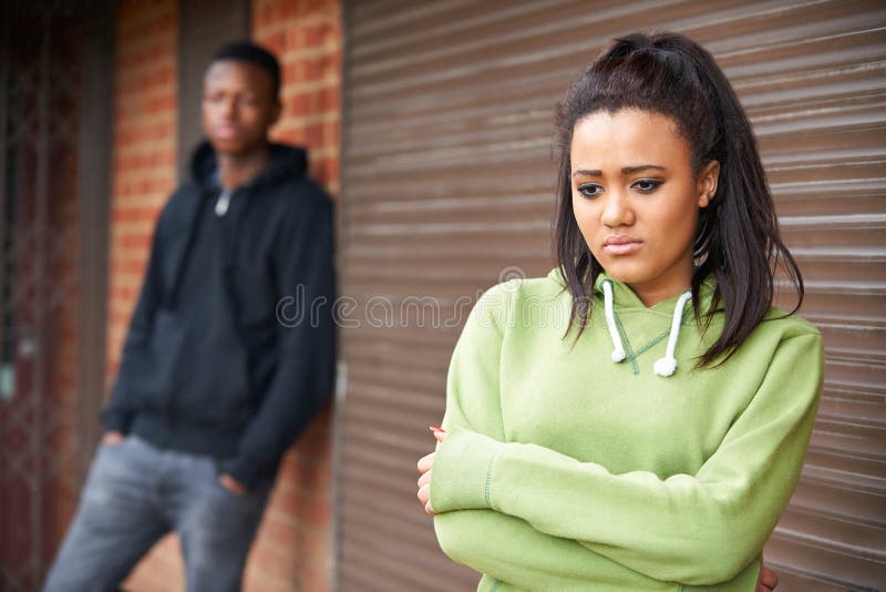 Portrait Of Unhappy Teenage Couple In Urban Setting