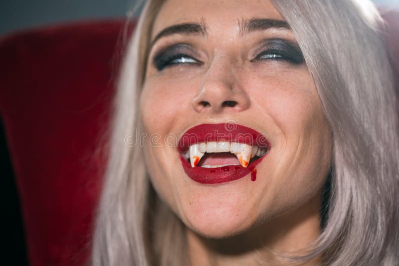 Vampire Woman with a Bloody Mouth and Teeth Fangs Celebrating a Stock ...