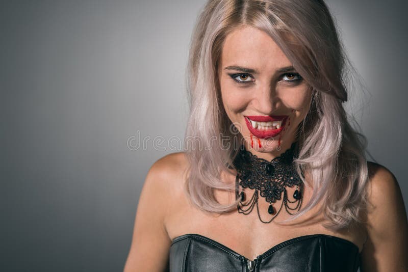 Vampire Woman with a Bloody Mouth and Teeth Fangs Celebrating a Stock ...