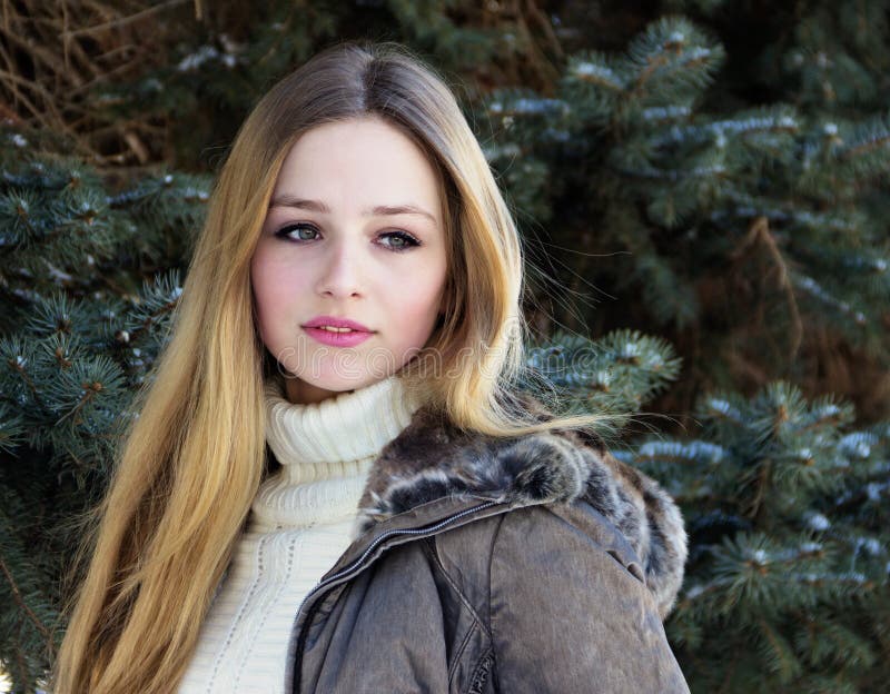 Cute Beautiful Teenage Girl Sitting In The Snow Stock