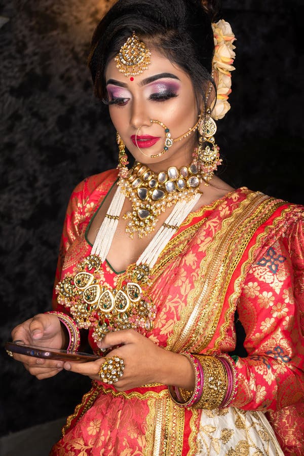 Magnificent Young Indian Bride in Luxurious Bridal Costume with