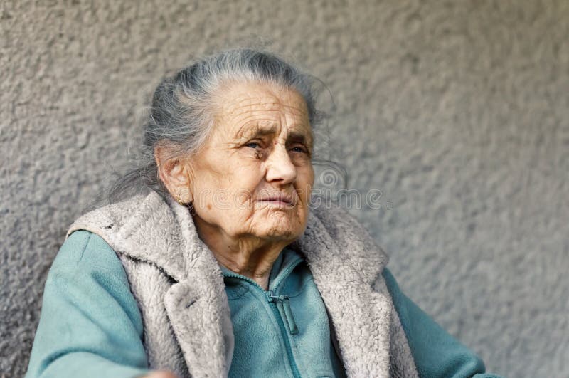 Real old women. Woman with Wrinkles in Grey Studio.
