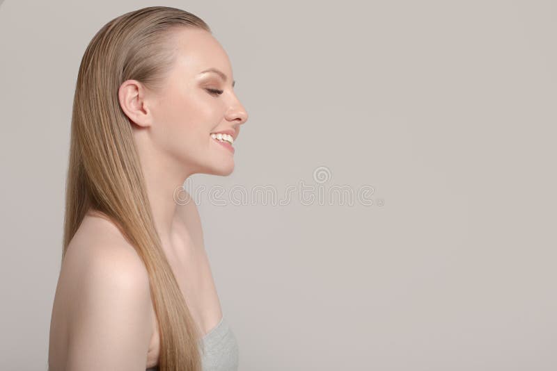 Portrait of a woman with clean skin and white straight hair. Pretty woman smiles royalty free stock image Portrait of a woman with clean skin and white straight hair. Pretty woman smiles royalty free stock image
