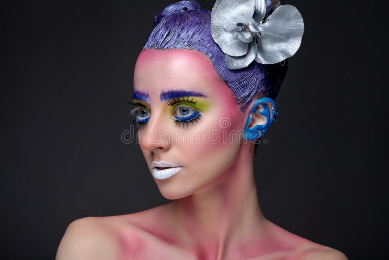 Portrait of a woman with creative make-up on a background. stock photos Portrait of a woman with creative make-up on a background. stock photos