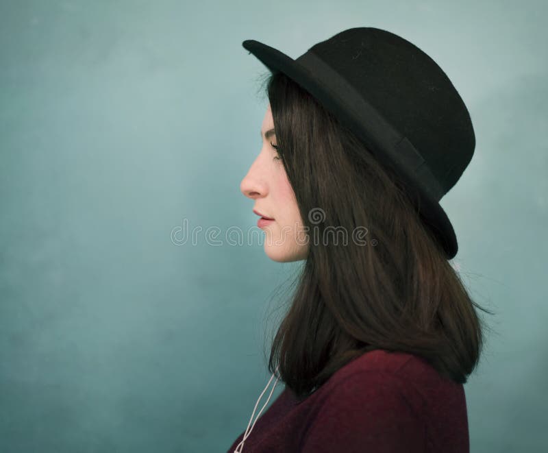 Portrait of a woman in a hat royalty free stock photo