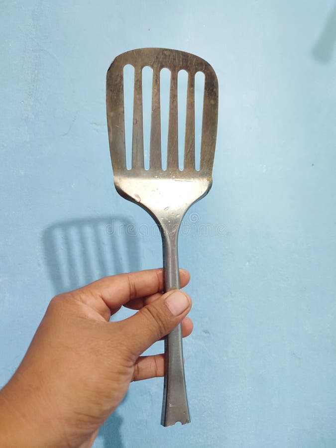 The Portrait of a Woman Holding the Broken Spatula in Her Hand Stock