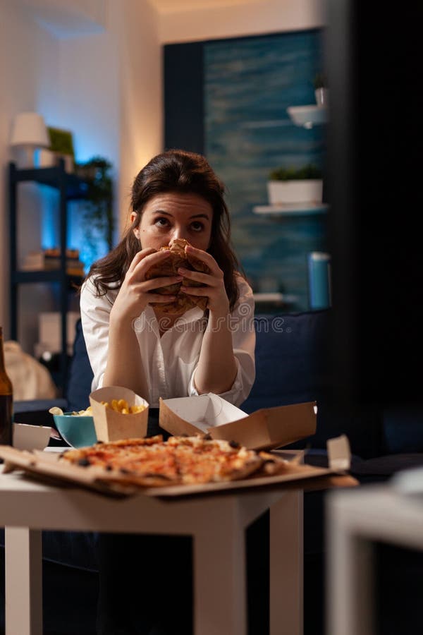 Portrait of woman holding delicious buger eating takeaway delivery food