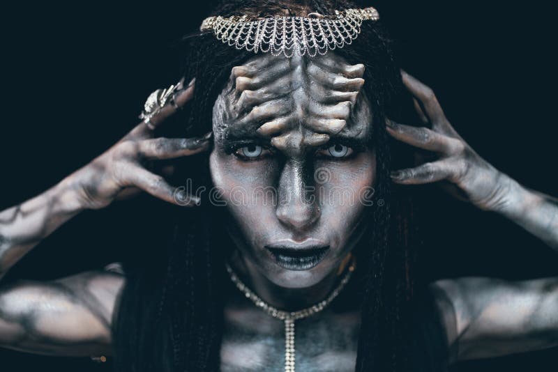 Portrait of woman in image of extraterrestrial alien with horns