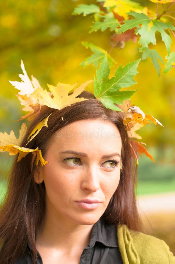 Young Girl in Leaf Headdress Stock Image - Image of serene, outdoor ...