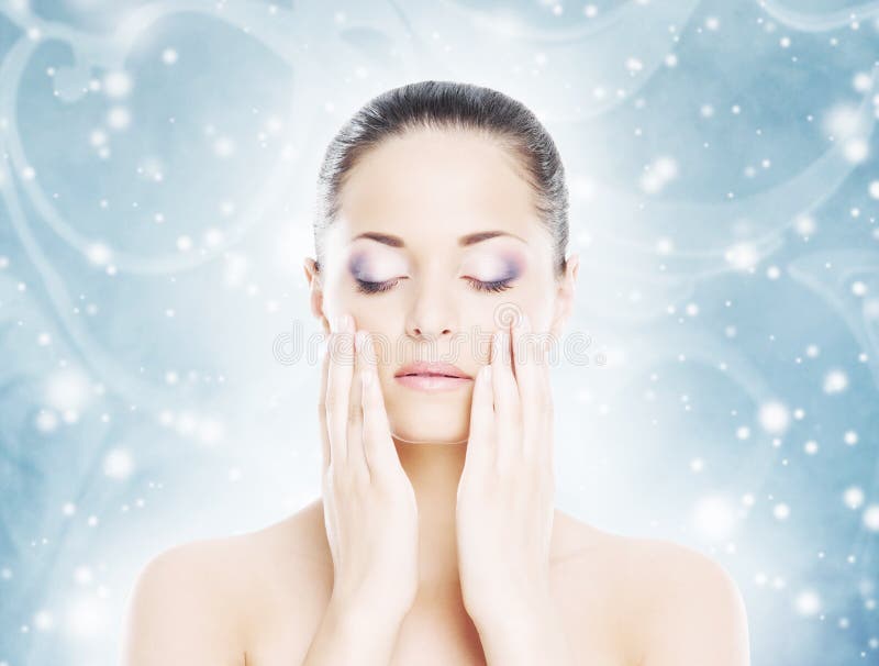 Portrait of a woman in makeup on a snow background. Aging, cosmetics.