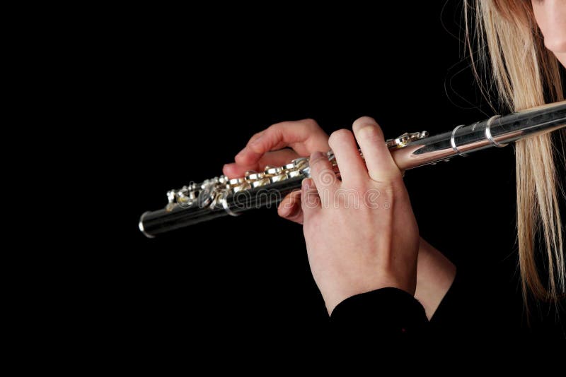 Portrait of a woman playing transverse flute stock image