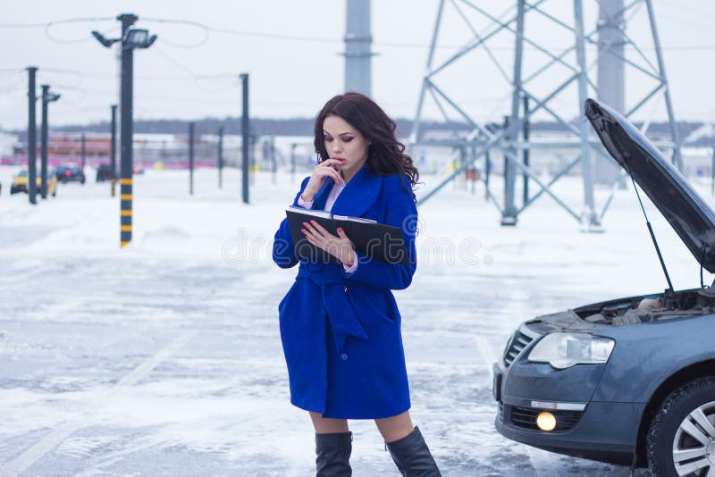 Portrait of Woman Reading a Manual Car Stock Photo - Image of stop