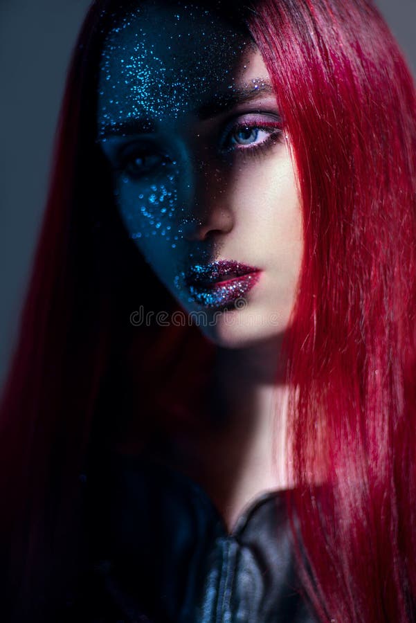 Portrait of woman with red hair and glitter make up stock images Portrait of woman with red hair and glitter make up stock images