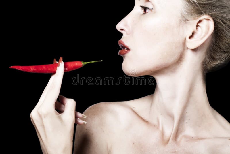 Portrait of the Woman with Red Lips and Red Burning Pepper Stock Image