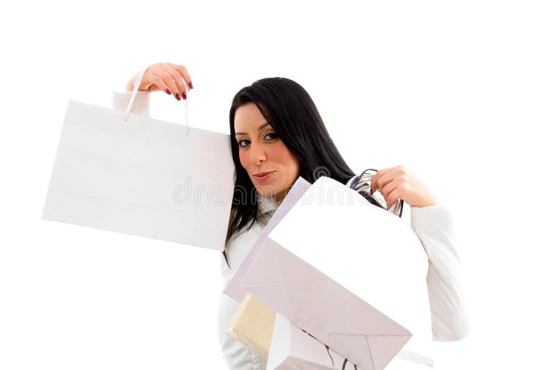 Portrait of woman showing shopping bags