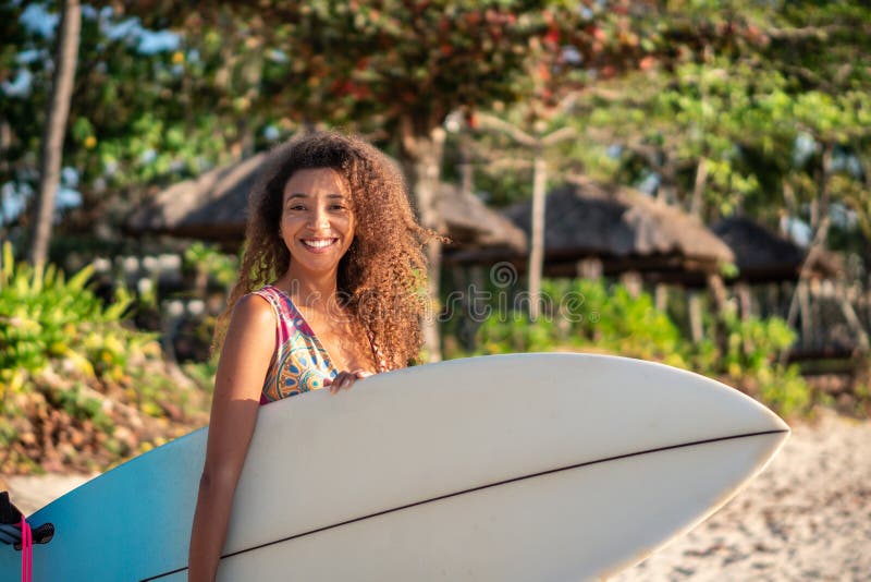 Portrait Of Woman Surfer With Beautiful Body On The Beach With Surfboard At Colorful Sunset 