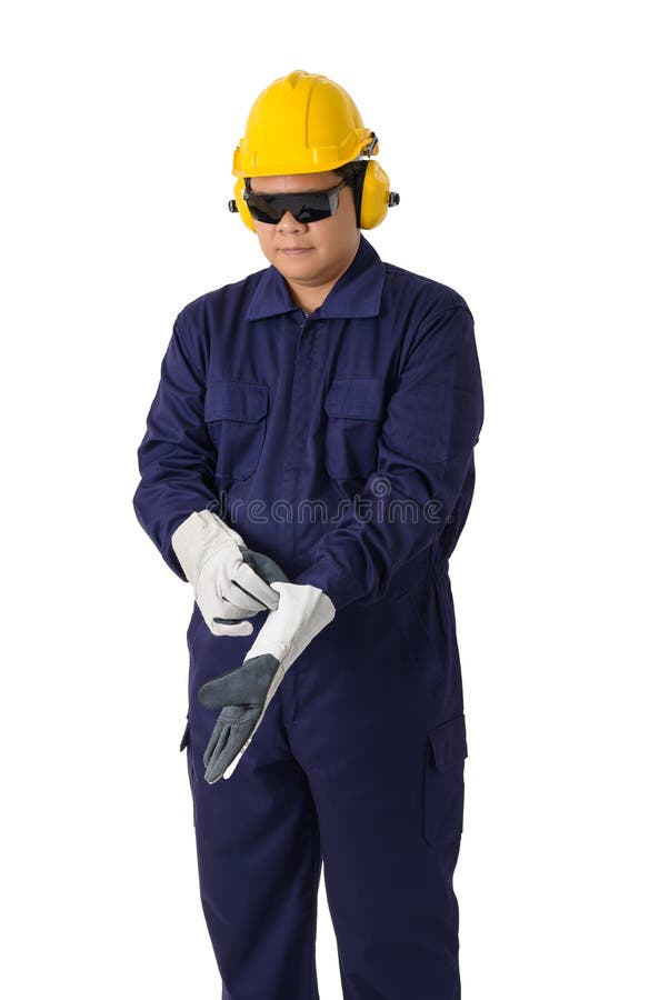 Portrait of a worker in Mechanic Jumpsuit is Removing gloves isolated on white background