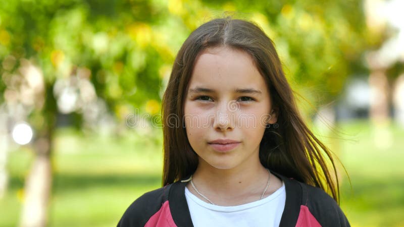 Portrait of an 11 year old girl with long hair.