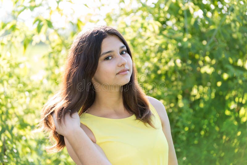 Portrait of 14 year old girl outdoors on a sunny day