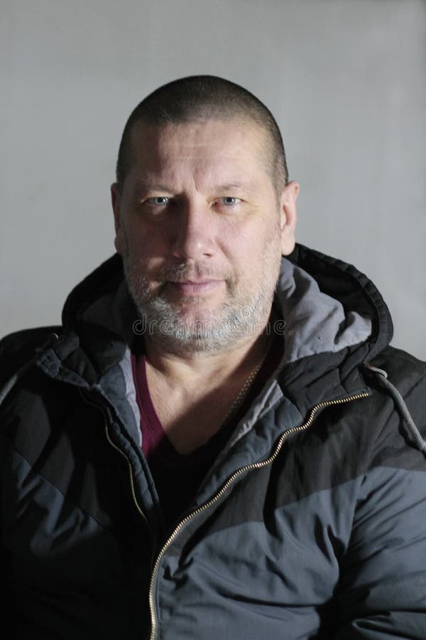 Portrait of 40 year old man sitting,close-up