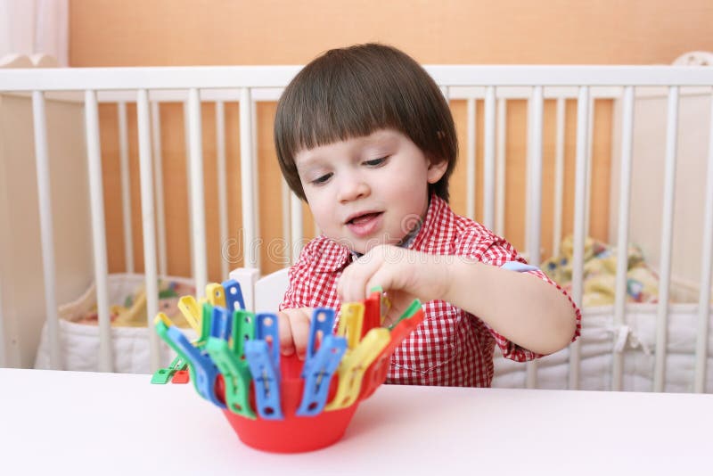 Portrait Of 2 Years Child Playing With Clothes Pins Stock Image Image