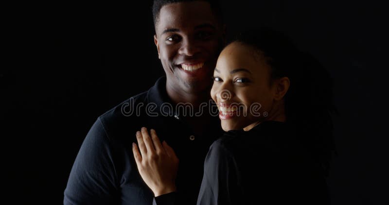 Portrait of young African couple holding each other smiling royalty free stock images Portrait of young African couple holding each other smiling royalty free stock images