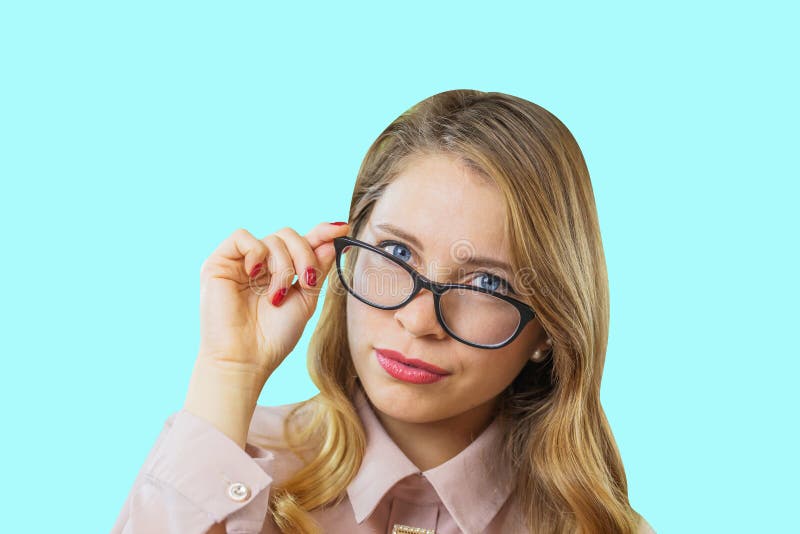 Portrait Of A Young Attractive Blonde In Glasses Who Is Holding Glasses