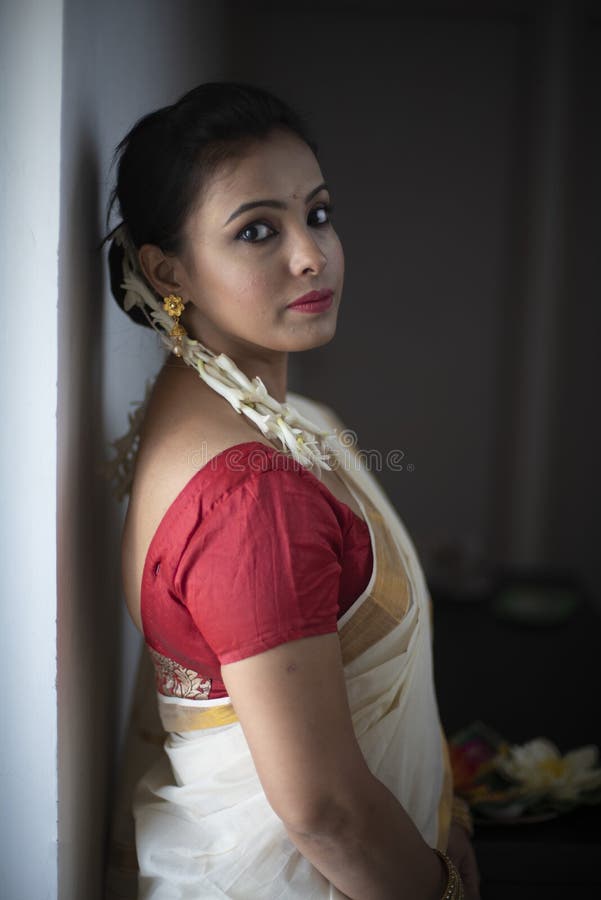 Portrait of an Young and Attractive Indian Woman in White Traditional Wear  for the Celebration of Onam/Pongal Stock Photo - Image of fashion, flower:  165842344