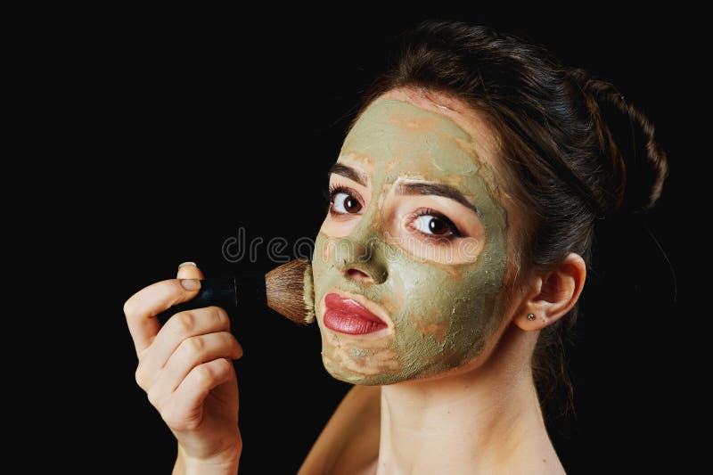Portrait of a young attractive woman in a cosmetic mask . stock photography Portrait of a young attractive woman in a cosmetic mask . stock photography