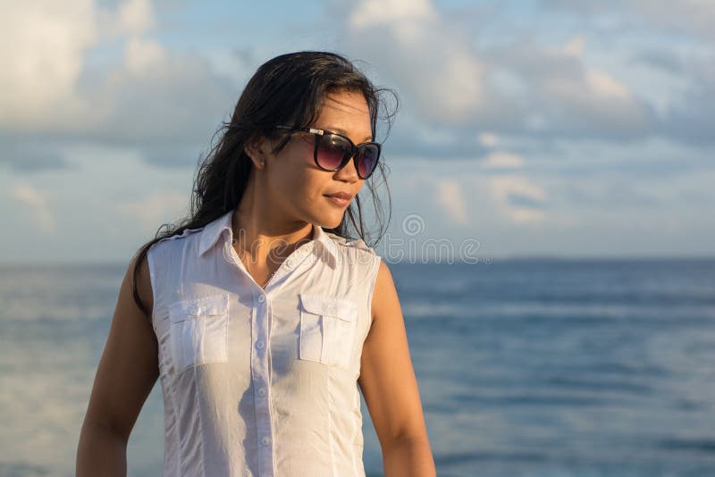 Portrait of a young beautiful asian lady in sunglasses looking a side royalty free stock images Portrait of a young beautiful asian lady in sunglasses looking a side royalty free stock images