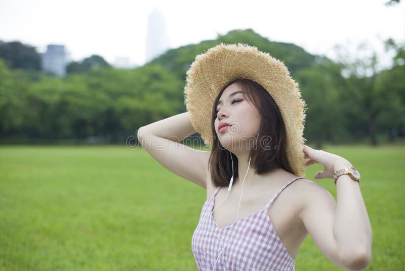 Portrait of young beautiful Asian woman enjoy lifestyle traveling int he Park royalty free stock images Portrait of young beautiful Asian woman enjoy lifestyle traveling int he Park royalty free stock images