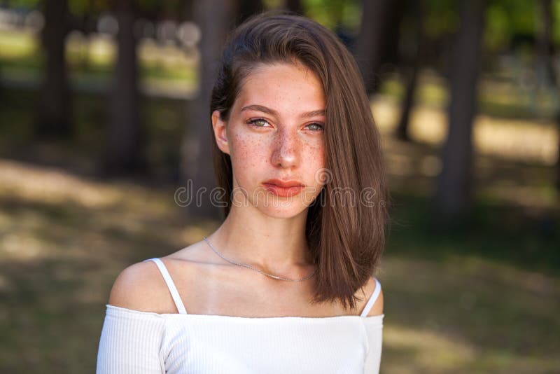 Young Beautiful Brown Haired Girl With Freckles On Her Face Stock Image 