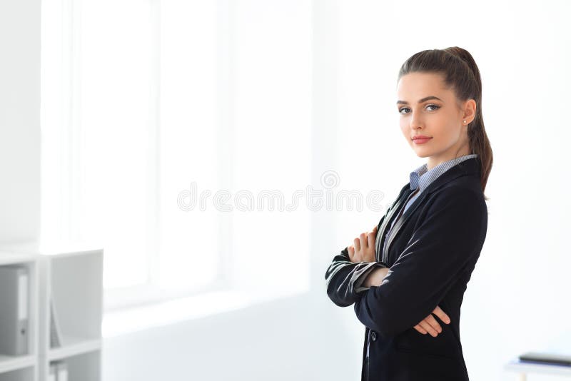 Portrait of young beautiful business woman in the office