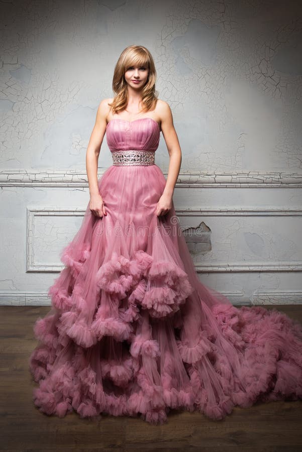 Portrait of young beautiful girl in long pink dress stock photos Portrait of young beautiful girl in long pink dress stock photos