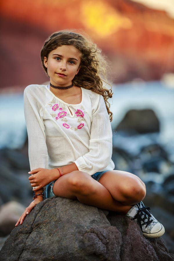 Portrait of young and beautiful girl in Oia.
