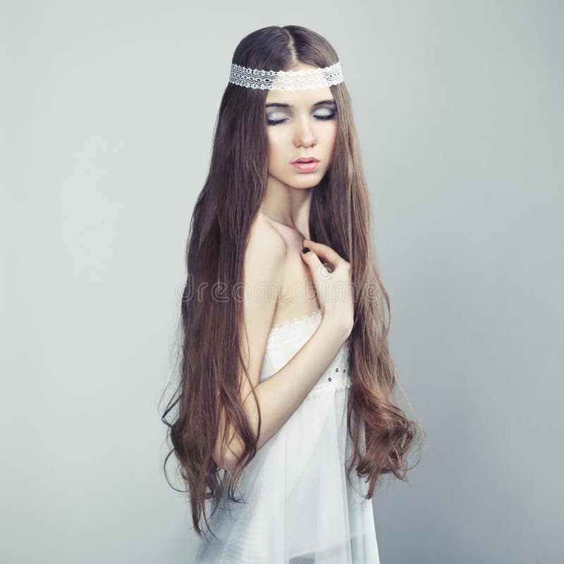 Portrait of a young beautiful girl with wavy hair