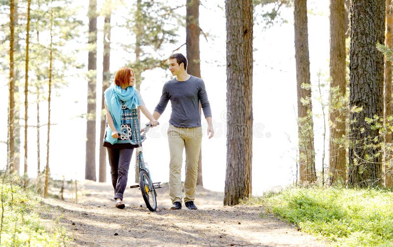 Portrait of a young beautiful happy couple outside