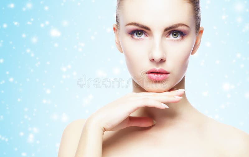 Portrait of young, beautiful and healthy woman: over winter background. Healthcare, spa, makeup and face lifting concept stock images Portrait of young, beautiful and healthy woman: over winter background. Healthcare, spa, makeup and face lifting concept stock images