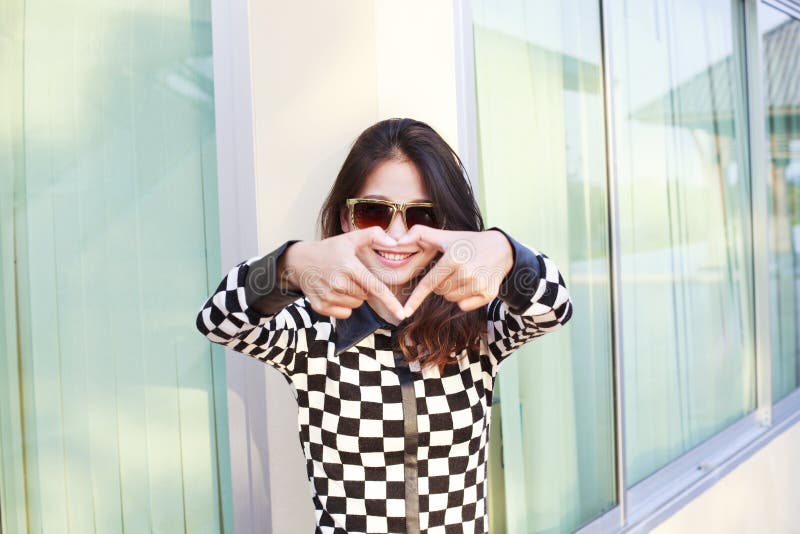 Portrait of young beautiful hipster woman wearing sun glasses ma