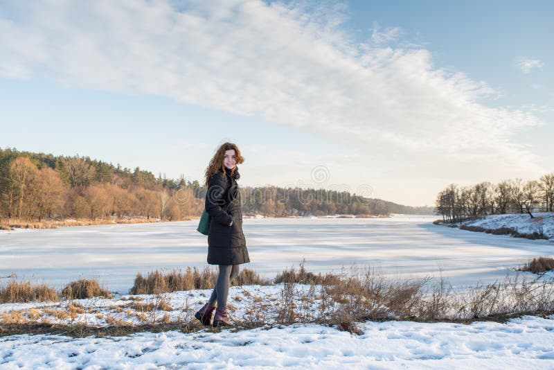 Portrait of a young beautiful red hair european girl in winter season