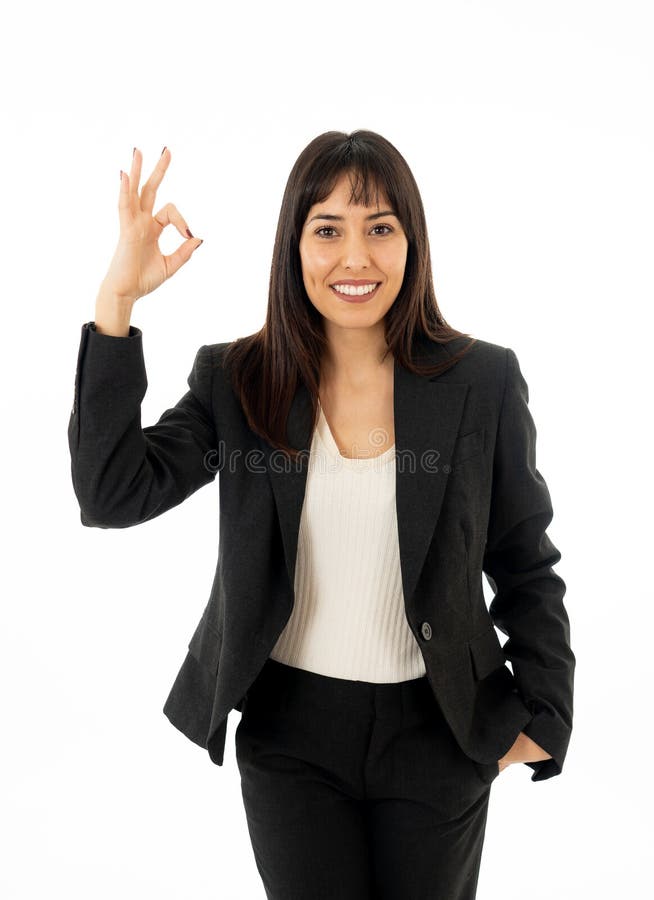 Portrait of young beautiful smiling business woman doing all OK sign Isolated on white background stock images Portrait of young beautiful smiling business woman doing all OK sign Isolated on white background stock images