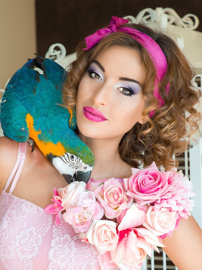 Portrait of young beautiful woman in doll style with ara stock photo Portrait of young beautiful woman in doll style with ara stock photo