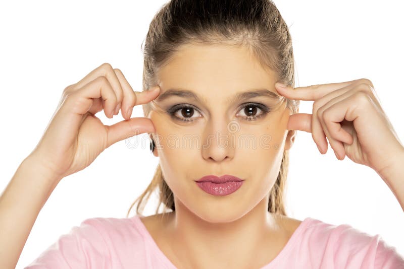 A Beautiful Young Woman Pinching Her Nose To Get Rid Of Bad Smell Stock