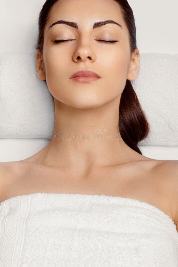 Portrait Of Young Beautiful Woman In Spa Salonspa Body Massage