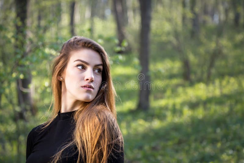Portrait of a Young Blonde Girl in Forest Looking Away Stock Photo ...