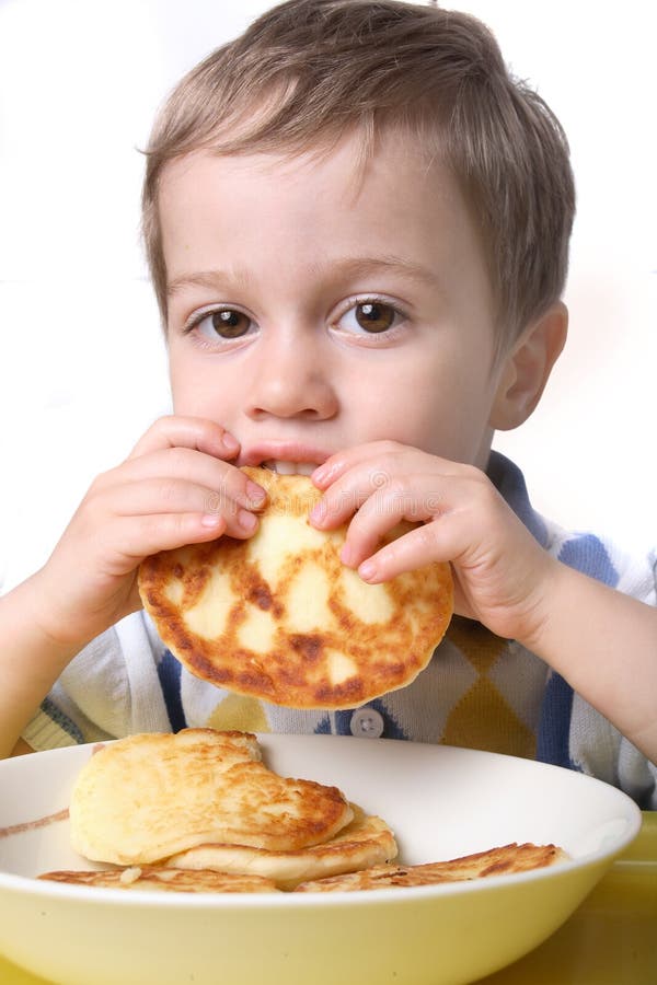 Portrait Of A Young Boy Having Breakfast Stock Photo - Image of closeup ...