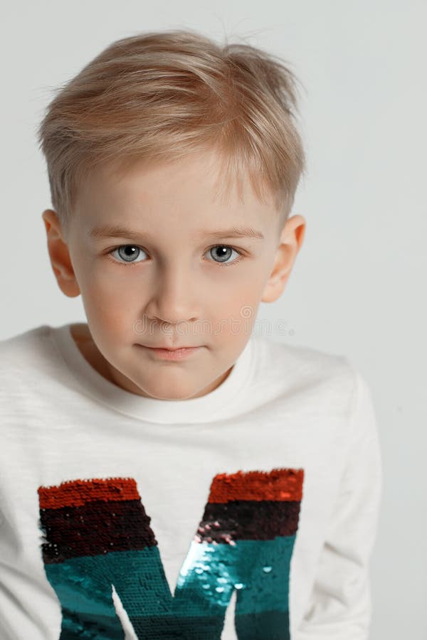 Portrait of a Young Boy Light Background Stock Image - Image of portrait, fashion: 161765673 Portrait of a Young Boy Light Background Stock Image - Image of portrait, fashion: 161765673