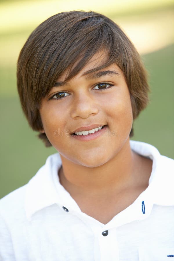 Portrait Of Young Boy In Park stock photo Portrait Of Young Boy In Park stock photo